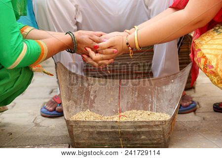Indian Mother Complete A Rasam In Wedding Ritual