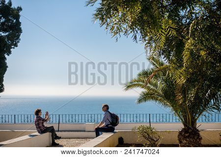 Altea, Spain - March 9 2018: Elderly Couple Tourist Taking Photos In Altea Town, Costa Blanca, Spain