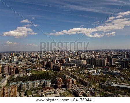 Forest in the Novosibirsk city,Siberia with diffrent trees and plants with some buildings in it. Str