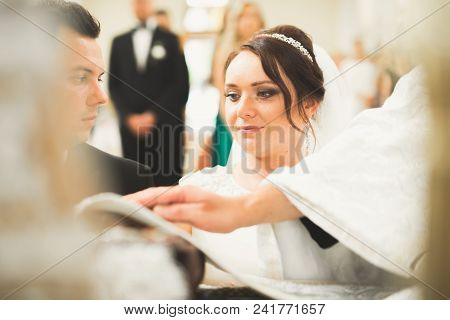 Wedding Couple Bide And Groom Get Married In A Church.
