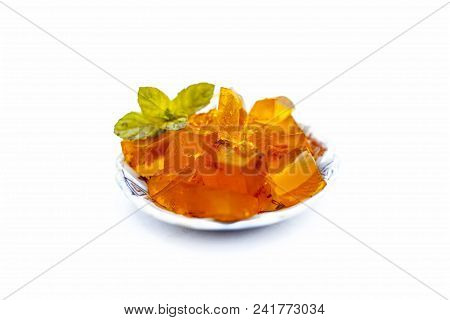 Orange Colored Halwa Grass Or China Grass Or Jelly In A Plate With Mint Leaves A Sweet Dessert Eaten