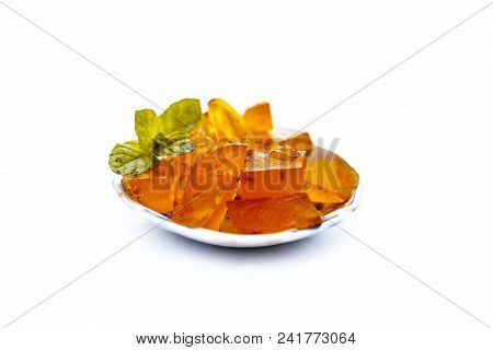 Orange Colored Halwa Grass Or China Grass Or Jelly In A Plate With Mint Leaves A Sweet Dessert Eaten