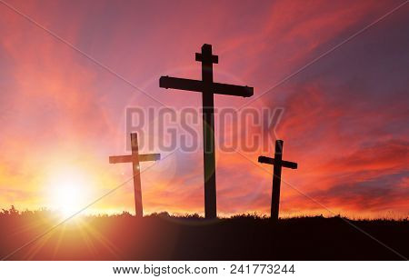 A Silhouette Of The Crucifixion Of Jesus Christ On A Cross With 2 Other Robbers Against A Dramatic S