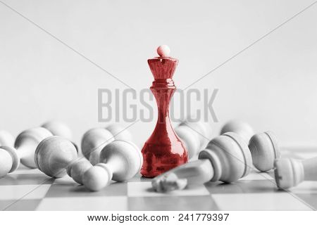 Black Chess Queen Beats Whites On Chessboard Over White Background. Win And Success Concept, Copy Sp