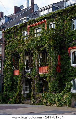 Emmerich Am Rhein, Germany - April, 27, 2018, The Building Is Covered With Ivy On The Promenade Of T