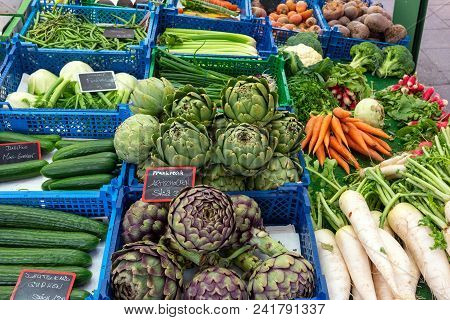 Fresh Vegetables For Sale At The Viktualienmarkt In Munich, Germany