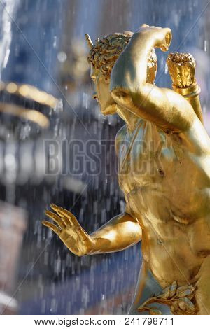 PETERHOF, ST. PETERSBURG, RUSSIA - MAY 10, 2018: Golden statues of the Grand Cascade. The cascade was built in 1715-1724 and is one of the remarkable fountain constructions in the world