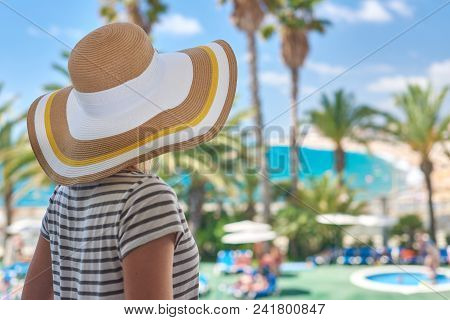 Beautiful Girl In Sun Hat Enjoying Amazing Sea View. Santa Susanna. Cataluna. Spain.