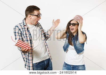 Young Shocked Couple, Woman And Man In 3d Glasses With Bucket For Popcorn On Head Watching Movie Fil