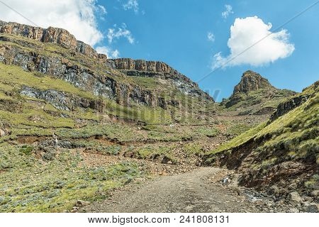 The Hairpin Bends In The Sani Pass. Four-wheel Drive Vehicles Are Visible In The Back