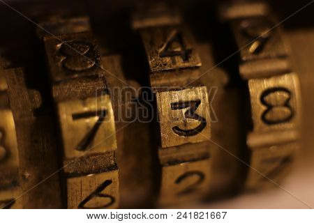 Retro Bronze Lock Number Combination. Code 738. Macro Closeup.