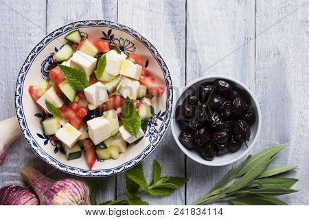 Greek salad with feta cheese cubes and fresk vegetables