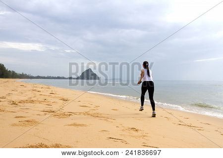 Woman Enjoy Morning Running On Beach At Bang Beot Beach, Chumphon Province Thailand