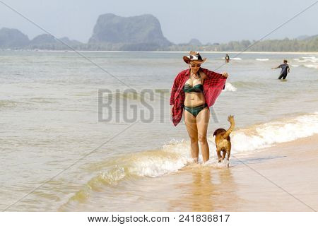 Woman With Beautiful Bikini And Dog Outdoor On Beach At Bang Beot Beach, Chumphon Province Thailand
