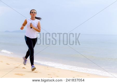 Woman Shape Pretty Morning Running On Beach At Bang Beot Beach, Chumphon Province Thailand