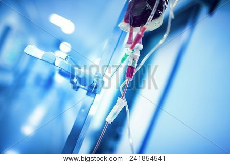 Blood Transfusion System Hanging On The Iron Pole Ready To Use In The Hospital Hall.