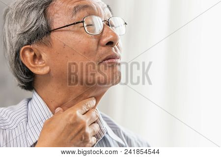 Asian Elder Old Man Sore Throat Irritation And Have A Phlegm Hand Touching Neck.