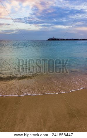 View of an empty beach in a overcast day in Sesimbra, Portugal