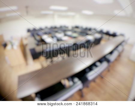 Blurred Image Of Empty  Meeting Room, Conference Room, Board Room With Rustic Wooden Flooring, Meeti
