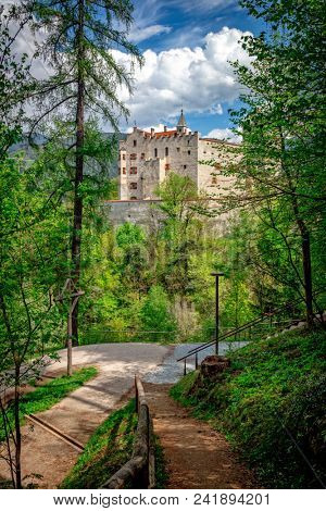 view of brunico castle in cloudy day