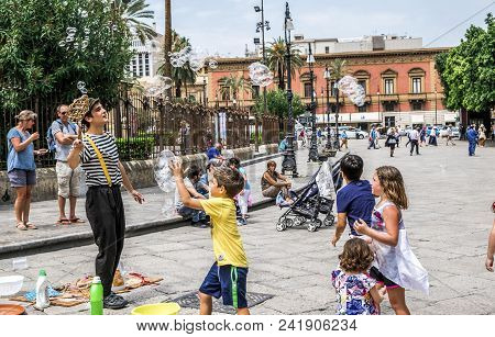Palermo, Italy - April, 2018: Street Artist Making Soap Bubbles On The Street In Piazza Giuseppe Ver