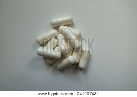 Heap Of White Capsules Of Magnesium Citrate From Above