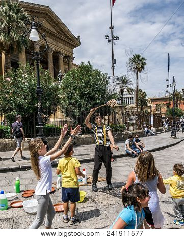 Palermo, Italy - April, 2018: Street Artist Making Soap Bubbles On The Street In Piazza Giuseppe Ver