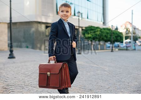 Concept Future Businessman. Business Meeting. Low Angle Of Future Businessman In Formal Wear Walking