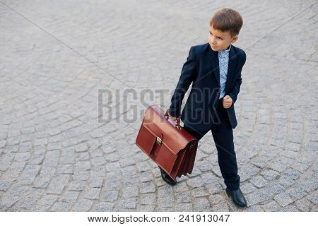 Concept Future Businessman. High Angle Of Businessman In Formal Wear Standing On Pedestrian Street C