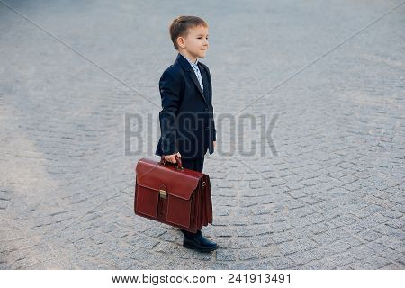 Concept Future Businessman. Business Meeting. Side View Of Future Businessman In Formal Wear Walking