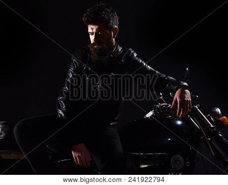Macho, Brutal Biker In Leather Jacket Stand Near Motorcycle At Night Time. Brutality And Masculine C