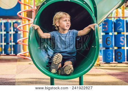 Funny Cute Happy Baby Playing On The Playground. The Emotion Of Happiness, Fun, Joy.