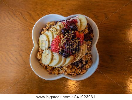 Healthy Acai Berry Bowl With Fruit And Granola.