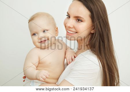 Smiling Happy Baby In Mothers's Hand. Little Enfant Toddler