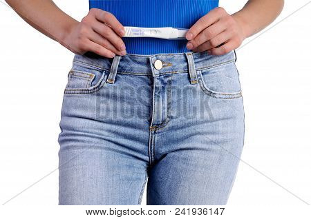 Woman Holdinj A Positive Pregnancy Test
