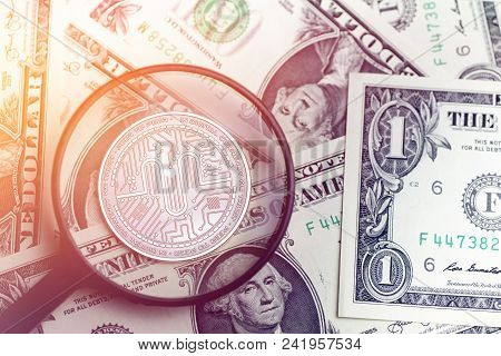 Shiny Golden Authorship Cryptocurrency Coin On Blurry Background With Dollar Money Token