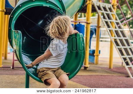 Funny Cute Happy Baby Playing On The Playground. The Emotion Of Happiness, Fun, Joy.
