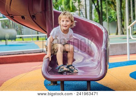 Funny Cute Happy Baby Playing On The Playground. The Emotion Of Happiness, Fun, Joy.