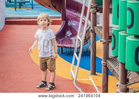 Funny Cute Happy Baby Playing On The Playground. The Emotion Of Happiness, Fun, Joy.