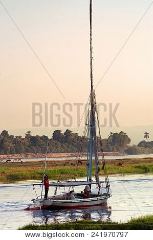 River Nile, Egypt - October 16, 2011: Tourists Sale On Felucca On Nile River On The Sunset In Egypt,