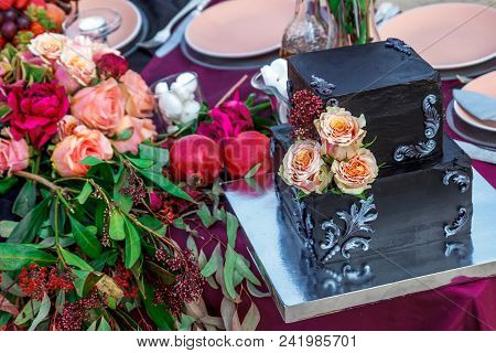 Wedding Cake With Rose And Fruit On Sunset Beatch