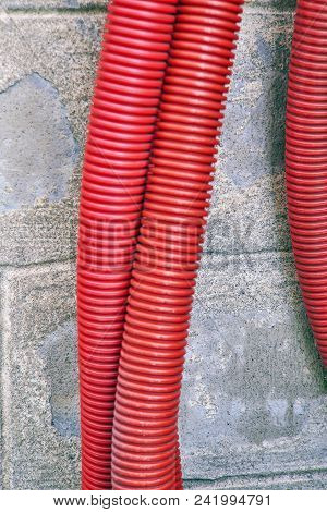 Red Corrugated Curvilinear Tubes For Construction Close-up