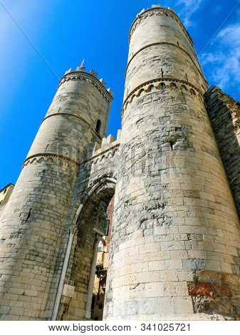 Italy. Genoa. Gate Of The Wall Of Barbarossa. Porta Soprana And Blue Sky