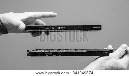 Paris, France - Mar 28, 2019: Man Hands Comparing Latest Nvidia Quadro Professional Gpu Video Card R