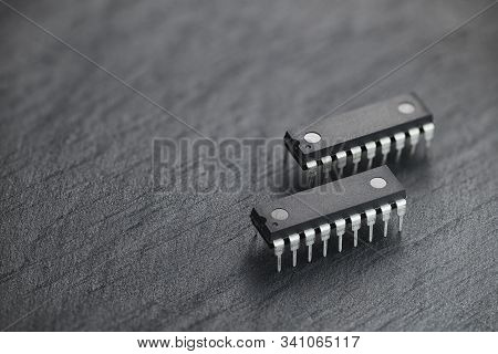 Integrated Circuit Chip In Dip Or Dil Package On Black Slate Rock Background