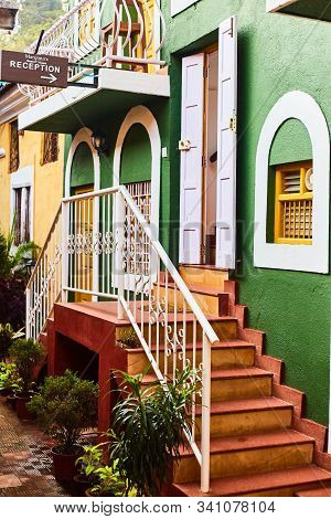 Panaji, India - December 16, 2019: Wall Of A House In Fontainhas Panjim Goa. Green Wall With A Door.