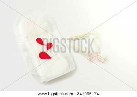 Protective Menstrual Pad With Fabric Blood Drops, Cotton Tampons On White Background. The Concept Of