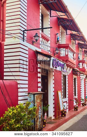 Panaji, India - December 15, 2019: A Narrow Lane Surrounded By Colorful Portuguese Houses In Panjim,