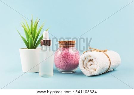 Beauty Composition With Pink Salt And Towel On Blue Background. Selfcare, Home Spa And Relaxation Co