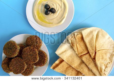 Famous Traditional Arabic, Middle East, Israel Cuisine. Tahina Dipping, Pita Bread And Falafel On Bl